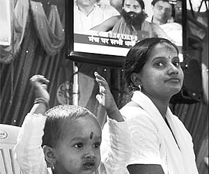 CATCH’EM YOUNG?: A toddler at a gathering to support Baba Ramdev | Express Photo