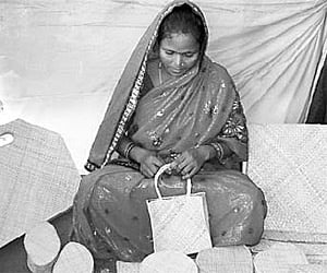 A woman preparing Kewda products