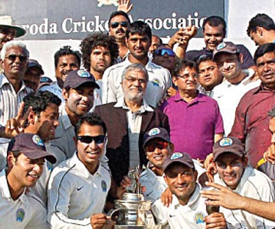 that winning feeling: Members of the Rajasthan team with the Ranji Trophy