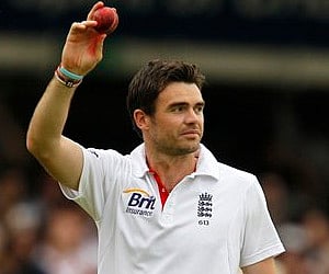 James Anderson waves to the crowd as he walks off the pitch holding a stump and a match ball as England defeat India in the first Test at Lord's. (AP)