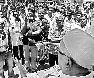 FOR A CAUSE: Hindu Munnani leader Rama Gopalan (R) addressing activists during the protest organised against the Mumbai blasts in Chennai on Sunday.