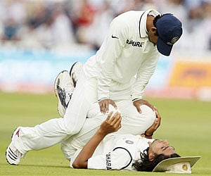 Ishant Sharma is helped to stretch by team mate Suresh Raina, during the second day of the first Test against England | AP