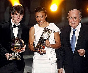 Lionel Messi  with the Ballon d'Or and Marta of Brazil, Women’s World Player 2010, alongside FIFA President Sepp Blatter. (Photo: AP)