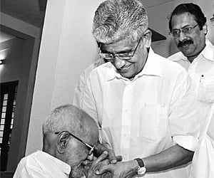 P K Narayana Panicker, who was elected president of  the NSS, fondly kisses the hands of G Sukumaran Nair in  Changanassery on Saturday | B P Deepu