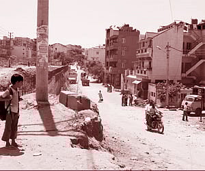 (Clockwise from top) Karthiyanagar, no roads present; Chikkalasandra main road; Unfinished road work in the ward
