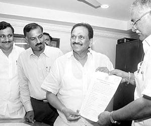 ACA secretary G Gangaraju submitting his nomination for the cricket association polls to senior vice-president J Narendra in Vijayawada on Monday.