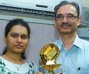 Humpy, who won the Women’s GP in Doha recently, with her father and coach Koneru Ashok after returning home on Monday.