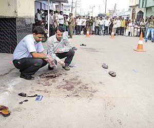 A BLOODY MORNING: Detectives gather clues from the scene of the attack on Akbar Owaisi| Express Photo.