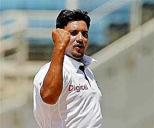 West Indies' Ravi Rampaul celebrates after bowling out India's opener Abhinav Mukund for 11 runs