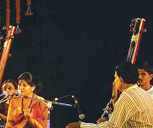 The partly charred school van after colliding with a bike at Periyagoundapuram on Friday