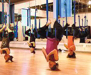 Anwar Wahhab (right) instructs a kettlebell convert.