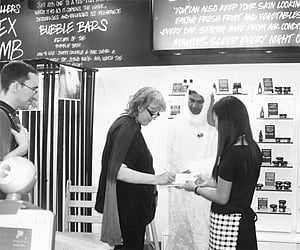 A volunteer adds her signature in support of the campaign to end animal testing for cosmetics | EPS