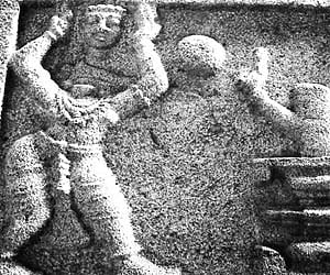 A Sheela Shashana found at Srisailam Mallikarjuna Devalaya depicting a devotee cutting his head in front of a Shivalingam