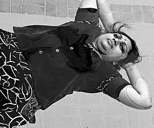 Daisyrani demonstrating asanas at Club Melaange swimming pool in Erode