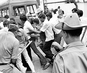 The police chasing away the students who were protesting against Tumkur University’s decision to reduce seats in the PG courses in Tumkur on Saturday.