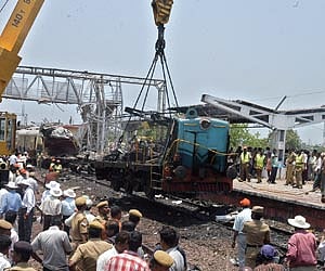 Locals feeding water to one of the victims who jumped off the East Coast Express to escape from cops in Visakhapatnam on Sunday | EPS