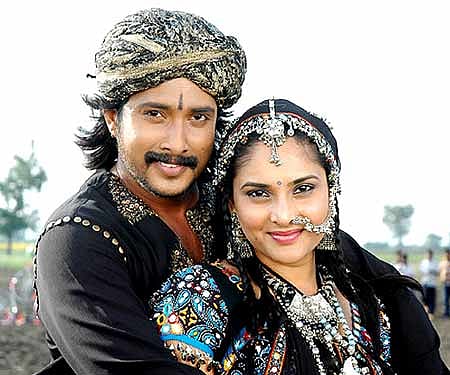 The promotional poster of 'Jothegaara' featuring Prem and Ramya.