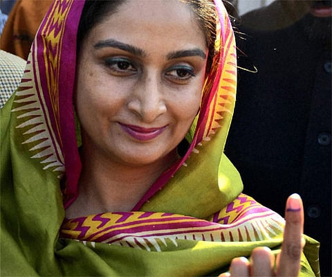 SAD MP Harsimrat Kaur Badal showing her marked finger after casting her vote for assembly polls at a polling booth in Badal village in Bathinda. PTI