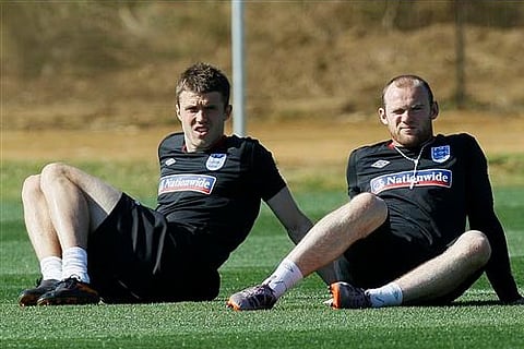 England soccer players Michael Carrick and Wayne Rooney during a team training session. AP