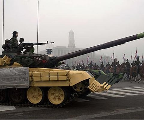 An Indian soldier rides in a T-72 tank as a mounted Calvary unit marches past during preparations for Republic Day in New Delhi, India, Tuesday, January 17. (Photo: AP)