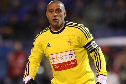 Former Brazil defender Roberto Carlos retires