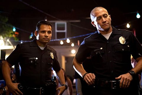 Michael Pena, left, and Jake Gyllenhaal in a scene from 'End of Watch'. (AP Photo/Open Road Films, Scott Garfield)