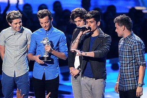 Members of the British band One Direction, from left, Niall Horan, Louis Tomlinson, Harry Styles, Zayn Malik and Liam Payne accept the award for best new artist at the MTV Video Music Awards (Photo by Matt Sayles/Invision/AP)