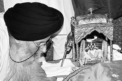 Sikh devotees pay respects to 100-year-old Guru Granth Sahib