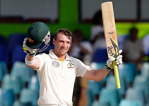 In this file photo Australia's batsman Phillip Hughes celebrates after scoring a century, Hughes died in a Sydney hospital, Nov. 27, 2014, two days after being struck in the head by a cricket ball during a domestic match. He was 25. (AP Photo)
