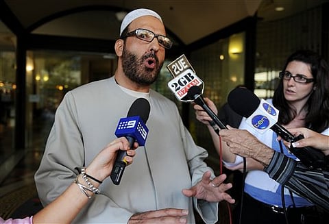 In this April 18, 2011 file photo of Man Haron Monis, believed to be the gunman inside the Lindt Cafe in Martin Place, speaks to the media as he leaves the Downing Centre in Sydney after a pre-trial hearing where he is accused of sending offending letters