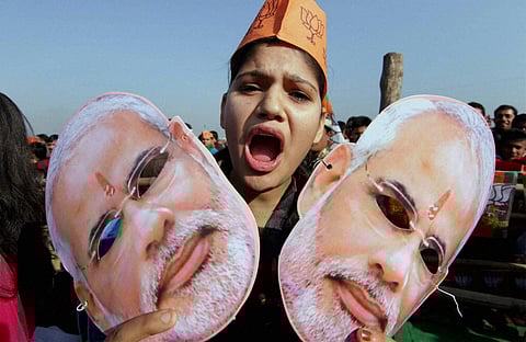 Supporters of BJP wearing masks of Prime Minister Narendra Modi during an election campaign rally in Vijaypur in Samba J K on Monday | PTI