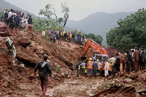 Rescue workers clear the debris at the site of a landslide in Malin village in Pune Maharashtra on Wednesday | PTI