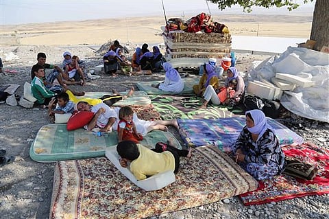 Displaced Iraqis from the Yazidi community settle at the Qandil mountains near the Turkish border outside Zakho, 300 miles (475 kilometers) northwest of Baghdad, Iraq, Saturday | AP