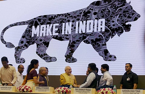 Prime Minister Narendra Modi with Law Minister Ravishankar Prasad and Commerce Minister Nirmala Sitharaman during the launch of "Make in India Mission" at Vigyan Bhavan in New Delhi on Thursday | PTI