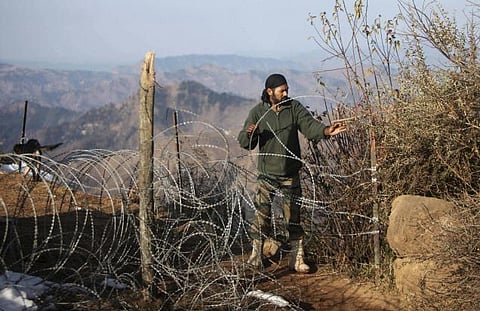 An Army man works near the Line of Control, in Jammu and Kashmir.  