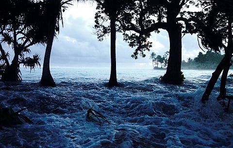 In this Jan. 21, 2015 photo released by Bikini Atoll Local Government, waves surge during a king tide event on Kili in the Marshall Islands. Two king tide events has hit the Kili in 2015 causing massive flooding over the entire island which left thousands
