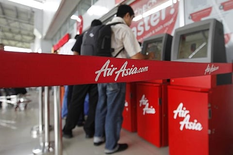 Passengers check in an AirAsia flight | Reuters File Photo