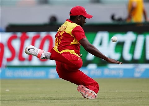 Zimbabwe's Elton Chigumbura attempts to take a catch during their Cricket World Cup Pool B match against the West Indies in Canberra, Australia, Tuesday, Feb. 24, 2015 | AP Photo