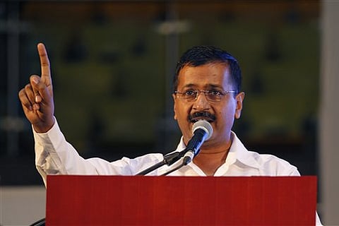 Delhi Chief Minister Arvind Kejriwal addresses a gathering after launching an anti-corruption helpline in New Delhi, India, Sunday, April 5, 2015. (AP Photo)