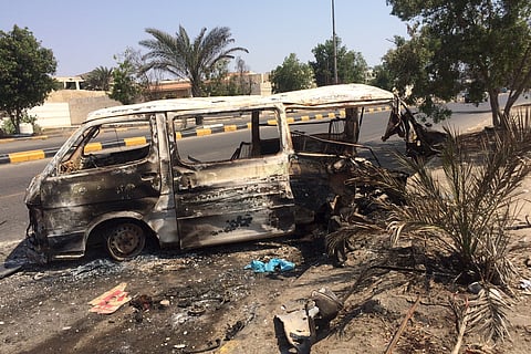 The wreckage of a minivan is seen on a street in Yemen's southern port city of Aden March 31, 2015. The rocket that tore through a minivan outside the Aden Grand Hotel last week killing nine men, women and children. (Reuters)