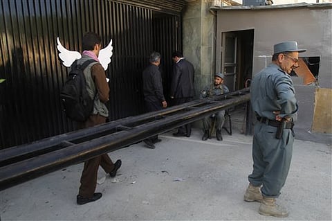 Afghan police guard Park Palace guesthouse. |AP