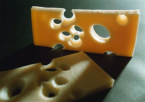 This undated file photo shows two slices of the famed Swiss Emmental cheese | AP