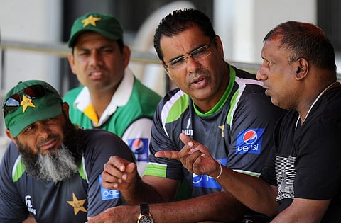 Former Sri Lankan cricketer Aravinda de Silva (R) speaks with Pakistan cricket coach Waqar Younis (2R) and bowling coach Mushtaq Ahmed (L). |AFP