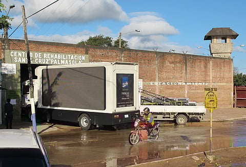 A sound truck attempts to enter the Palmasola prison gate in preparation for a visit by Pope Francis in Santa Cruz