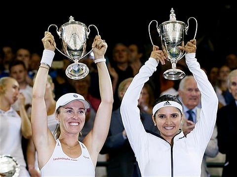 Top seeds Sania and Martina Hingis stormed into the prequarterfinals of women's doubles competition.| (File/AP)
