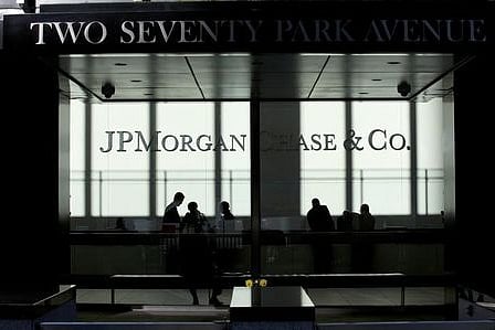 People walk inside JP Morgan headquarters in New York | REUTERS