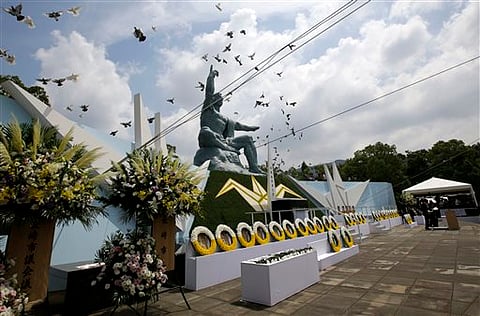 Doves fly over the Peace Statue during a ceremony to mark the 70th anniversary of the atomic bombing in Nagasaki, southern Japan. |AP