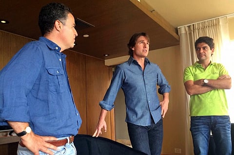 Handout photo released by Medellin's Mayoralty of US actor Tom Cruise (C) meeting with Medellin's Mayor Anibal Gaviria (L) and Colombian Juan Camilo Quintero (R), president of the Film Commission of Medellin in Medellin, Antioquia department, Colombia. 