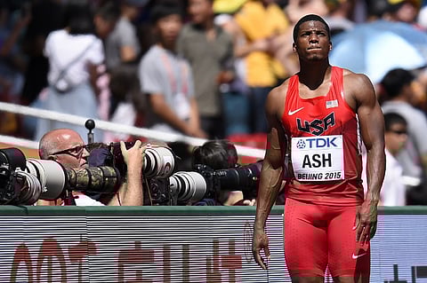 USA's Ronnie Ash leaves the track after being disqualified for a false start during the men's 110 metres hurdles athletics event at the 2015 IAAF World Championships at the "Bird's Nest" National Stadium | AFP