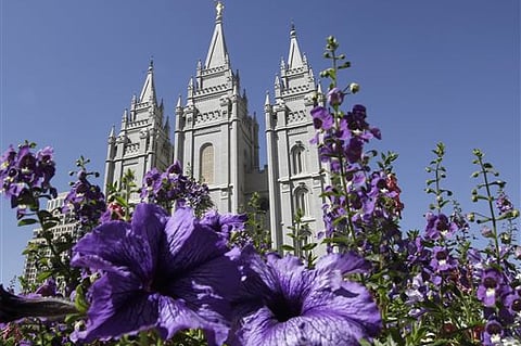 File photo shows flowers blooming in front of the Salt Lake Temple, at Temple Square, in Salt Lake City. |AP